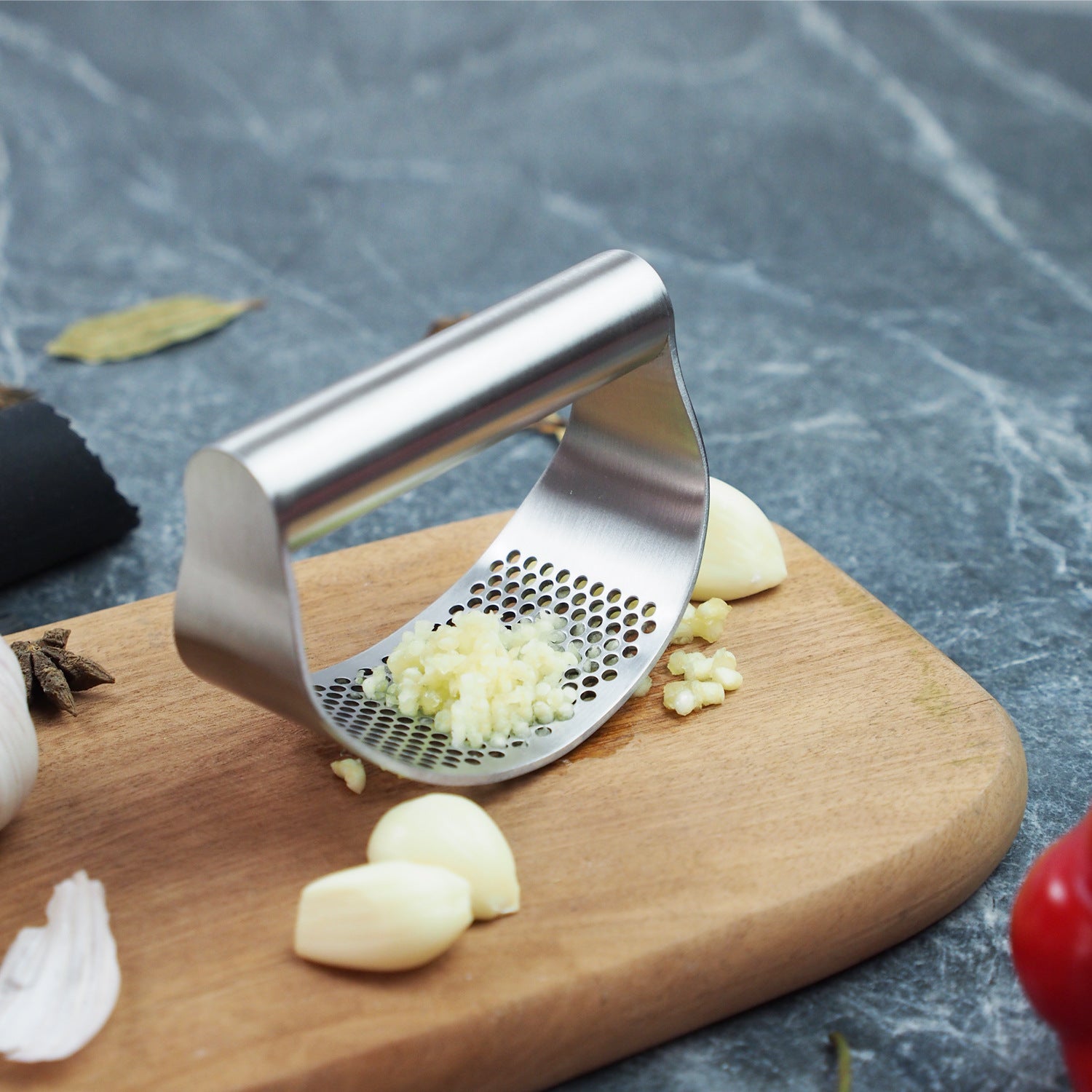 Triturador de ajo y jengibre en acero inoxidable grado alimenticio y ergonómico